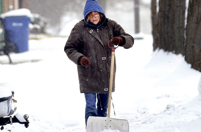 Shown in this News Tribune photo from Jan. 12, 2011, Beverly Vaughn removes snow the old-fashioned way, with a shovel.