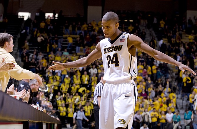 Missouri's Kim English shakes hands with fans as the final seconds of the clock tick off against Nebraska on Wednesday.