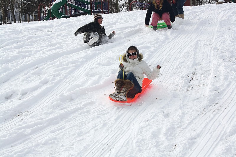 Mandi Steele/FULTON SUN photo: Caitlin Clark, 17 of Fulton, flies down a hill at Memorial Park, enjoying a snow day off of school Tuesday.