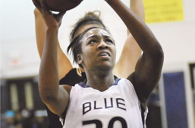 
Donisha Bronnon of Lincoln goes up for a shot during Wednesday night's game against Emporia State at Jason Gym. 