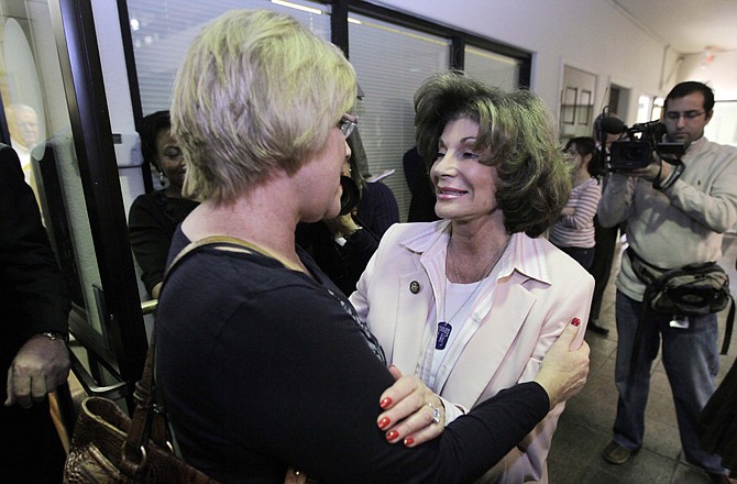 Rep. Shelley Berkley, D-Nev., right, meets a constituent during a two-hour "Congress on Your Corner" event Friday at her office in Las Vegas.