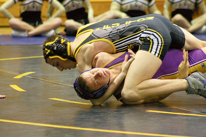 Stephanie Backus/FULTON SUN photo: Fulton senior Josh Curtis controls Hickman's Seth Beasley in their match at 140 pounds Tuesday night at Roger D. Davis Gymnasium. Curtis eventually pinned Beasley in 2:39, helping power the Hornets to a 47-18 dual victory over the Kewpies.
