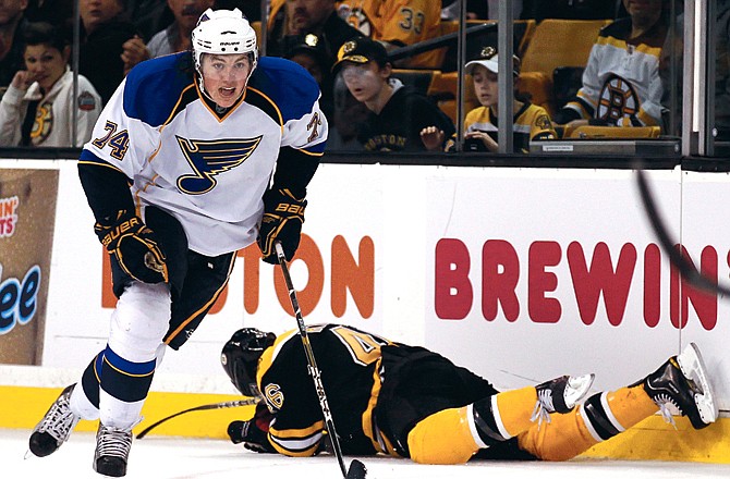 Blues center T.J. Oshie skates away with the puck after hitting and injuring David Krejci during a game last November in Boston.