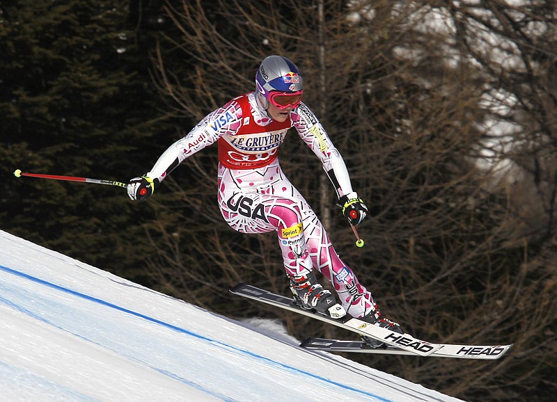 Lindsey Vonn, of the United States speeds down the hill on her way to win an alpine ski, women's World Cup super-G race, in Cortina d' Ampezzo, Italy, Friday, Jan. 21, 2011.