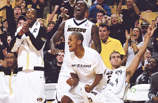 The Missouri bench celebrates after a basket late in their 87-54 victory over Iowa State during the second half of an NCAA college basketball game, Saturday, Jan. 22, 2011, in Columbia. Mo. 