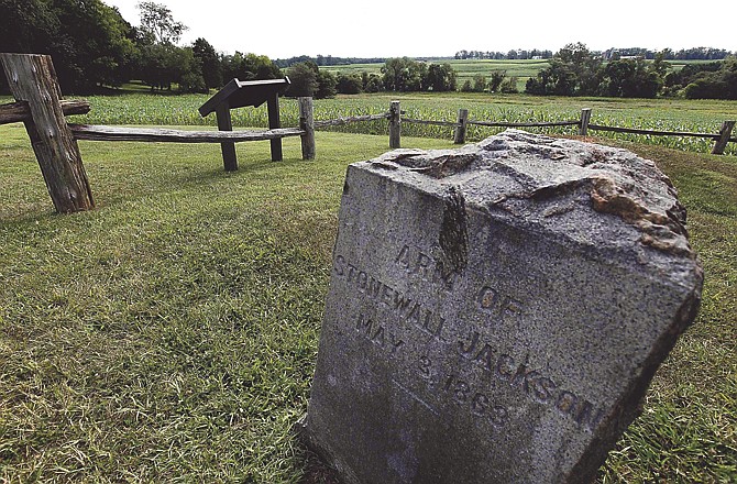 In this Aug. 7, 2009 file photo, a gravestone marker on the spot where the arm of General Stonewall Jackson is buried is near the Ellwood house in Locust Grove, Va. Civil War history will play out in a rural Virginia courtroom this week when Wal-Mart Stores Inc. defends a planned store near the hallowed site where Robert E. Lee and Ulysses S. Grant first met on a battlefield in 1864.