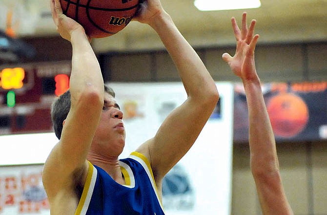 Patrick Schnieders, shown here going up for a shot during the Missouri National Guard Shootout last month at Fleming Fieldhouse, scored a school-record 53 points for Fatima on Monday night.
