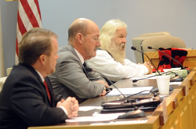 Leonard Steinman, right, makes his opening statement during a mayoral candidate forum Tuesday evening at City Hall. Candidates Eric Struemph and George Hartsfield listen at left and center. The forum was hosted by Downtown Jefferson City Inc., Rotaract Club of Jefferson City, and Young Professionals of the Jefferson City Area Chamber of Commerce.