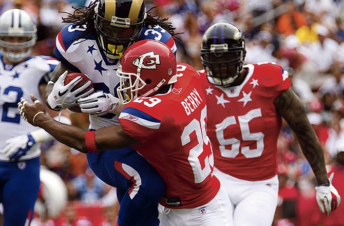 St. Louis Rams running back Steven Jackson (39) of the NFC runs through Kansas City Chiefs strong safety Eric Berry (29) of the AFC to score a touch down in the second quarter of the NFL Pro Bowl Sunday, Jan. 30, 2011 in Honolulu. 