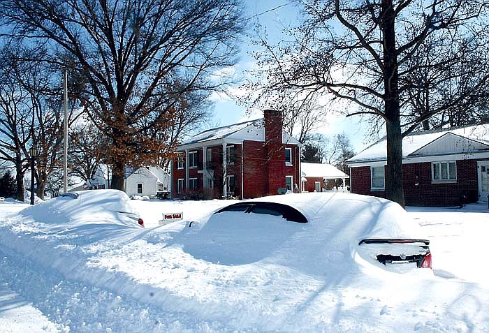 Cars were covered with snow after the snowfall which blanketed California.