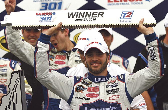 Five-time defending NASCAR champion Jimmie Johnson, shown here in Victory Lane after winning the Lenox Industrial Tools 301 at New Hampshire Motor Speedway in Loudon, N.H., doesn't think simply changing the points system was enough to fix NASCAR's larger issues. 