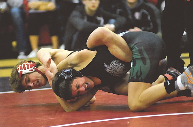 
Cole Baumgartner of the Jays works on Colton Orlando of Timberland during Saturday's 119-pound match at the Class 4 District 3 Tournament at Fleming Fieldhouse. 