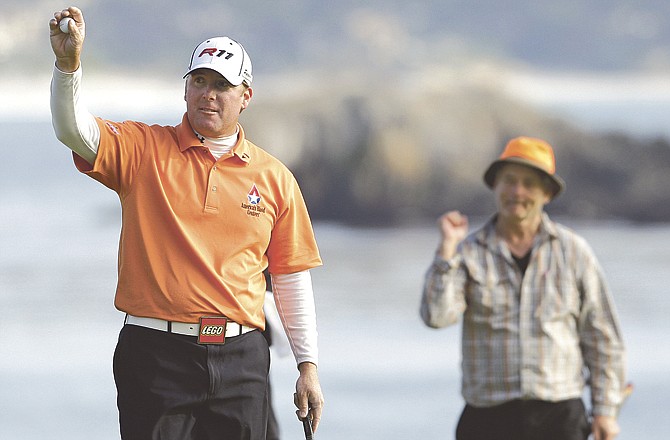 D.A. Points (left) waves after winning the AT&T Pebble Beach National Pro-Am as his playing partner, actor Bill Murray, looks on Sunday in Pebble Beach, Calif. 