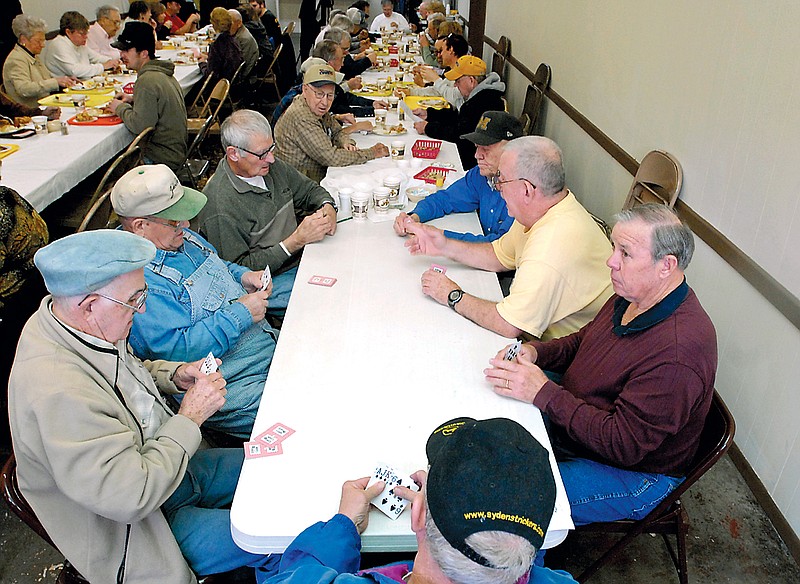 FULTON SUN file photo: Locals play cards and visit during a previous year's Auxvasse Loafer's Week get-together. 