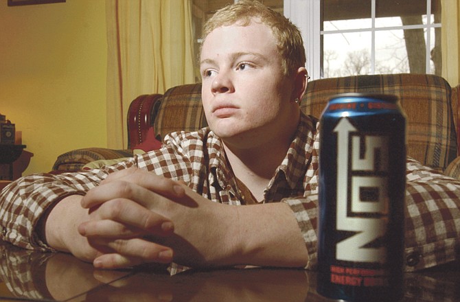 Dakota Sailor, who suffered a seizure after consuming several Nos energy drinks, poses for a photograph in Carl Junction, Mo. Energy drinks are under-studied, overused and can be dangerous for children and teens, warns a report by doctors who say kids shouldn't use the popular products.