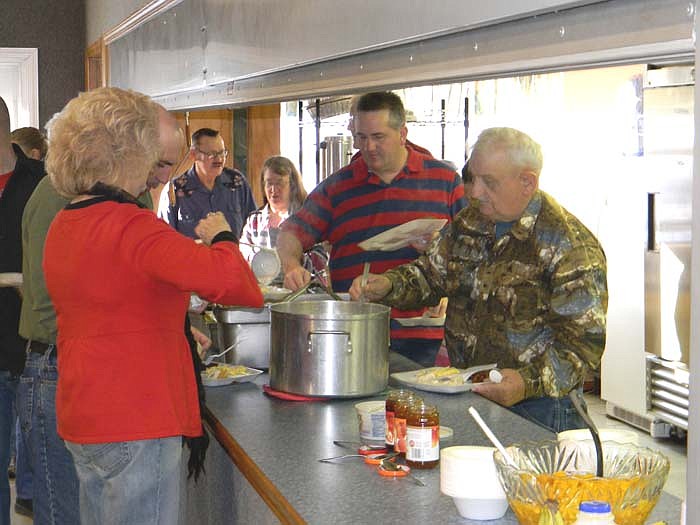 Scrambled eggs with cheddar, bacon, sausage, biscuits and gravy, fruit, orange juice, milk and coffee were served at the Valentine's Breakfast.