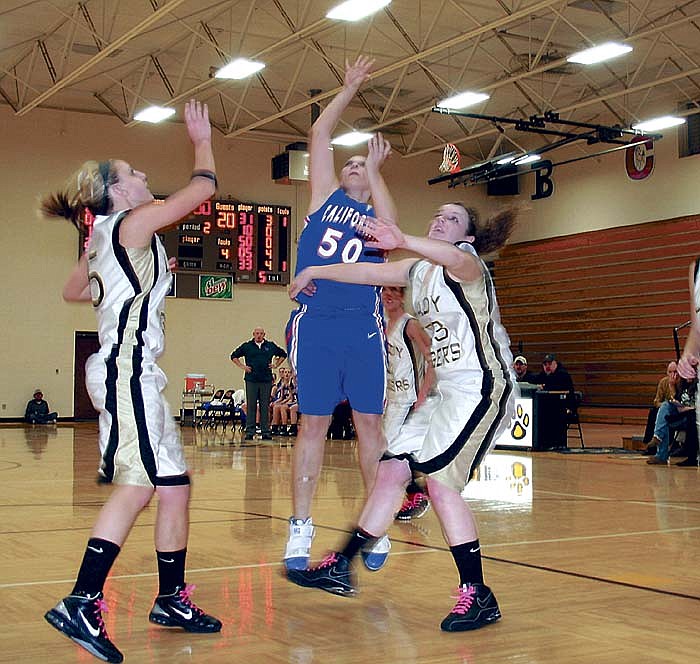 Kirstyn Roush (50) scores two points for California during the varsity contest at Versailles Feb. 7.