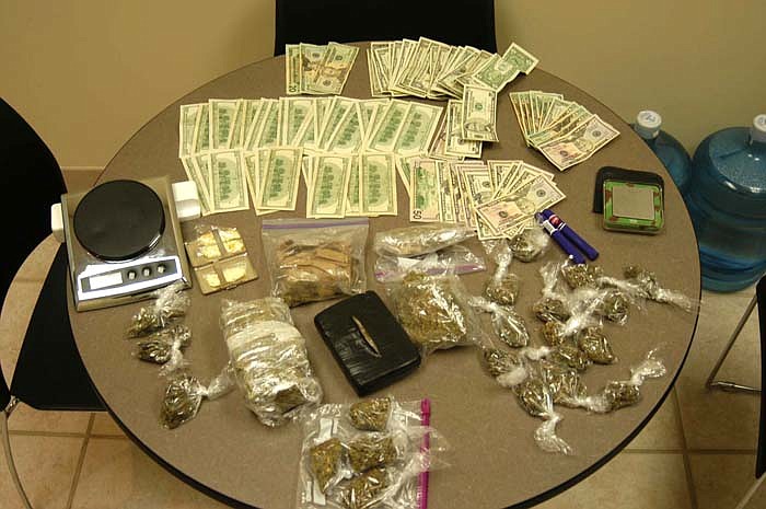 About $4,600 in cash, marijuana in brick form and packaged for distribution estimated at $4,000 in value Alprazolam worth about $3,000 and scales for weighing were seized in a drug bust by California City Police and the Mid-Missouri Drug Task Force at a residence in California on Friday, Feb. 11. 