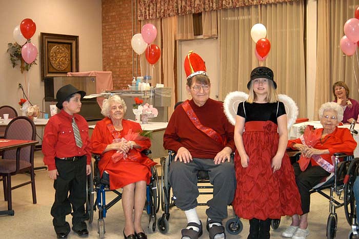 It's all smiles for Valentine Queen Veatrice Kilgore and King Billy Holleman at California Care following their crowning Friday. Attendants are, far left, Abel Herrera, son of Laydeli and Amalio Herrera, and far right, Kendra Dunham, daughter of Chris and Debborah Dunham.