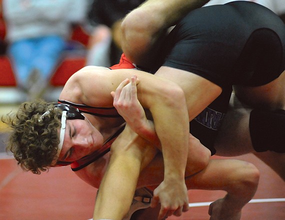 Jared Johnson of Jefferson City controls Lewis Foutz of Blue Springs during the 189-pound district title match Saturday night at Fleming Fieldhouse. Johnson won the match 1-0 and is undefeated heading into the Class 4 State Tournament, which begins at 5 p.m. today.