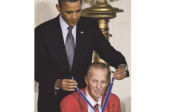 President Barack Obama awards baseball hall of fame member, former St. Louis Cardinals great Stan "The Man" Musial the 2010 Medal of Freedom during a ceremony in the East Room of the White House in Washington, Tuesday, Feb. 15, 2011