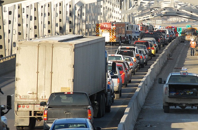 Traffic sits at a standstill on the northbound lanes of the Missouri River bridge at rush hour Thursday after a mulitple-vehicle accident. Traffic was backed up throughout town because of the accident.