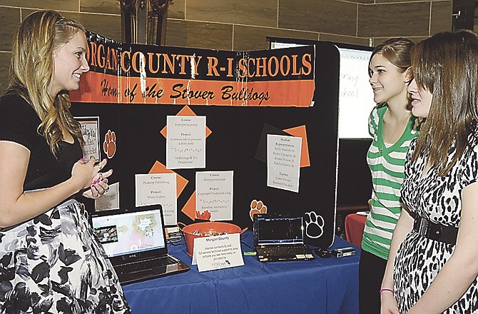 Kelley Marriott, left, Katelyn Goetze, right, and Kristin Wilson, all students from Morgan County R-1 High School in Stover, were on hand in the Capitol Rotunda third floor for a demonstration of technology in use at their school. 