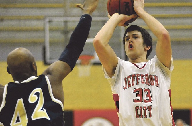 Jonny Richert of the Jays puts up a shot during Wednesday night's game against Miller Career Academy at Fleming Fieldhouse.