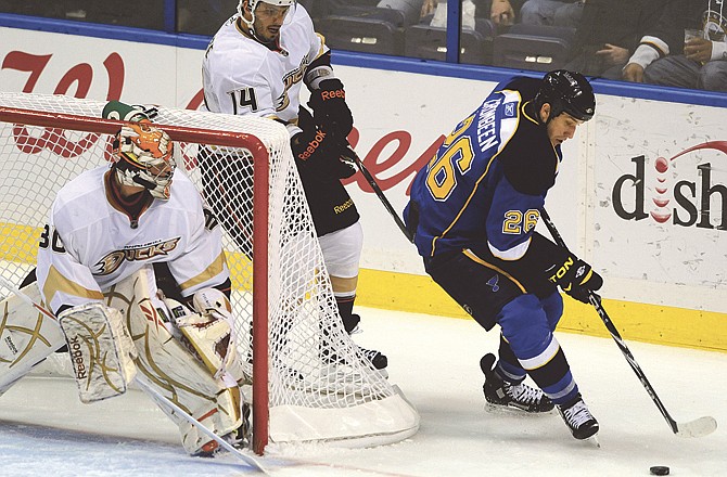 Anaheim Ducks goalie Timo Pielmeier (30), of Germany, guards the goal against St. Louis Blues' BJ Crombeen (26) as the Ducks' Maxim Lapierre (14) skates behind in the second period of an NHL hockey game Saturday, Feb. 19, 2011, in St. Louis.