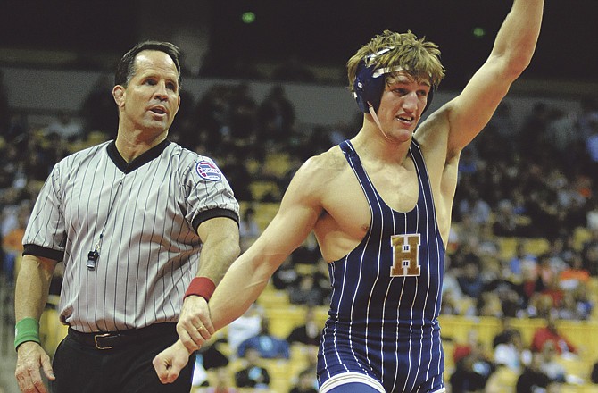 Helias' Ty Loethen celebrates after winning the 152-pound title in Saturday's Class 3 State Championships at Mizzou Arena. 