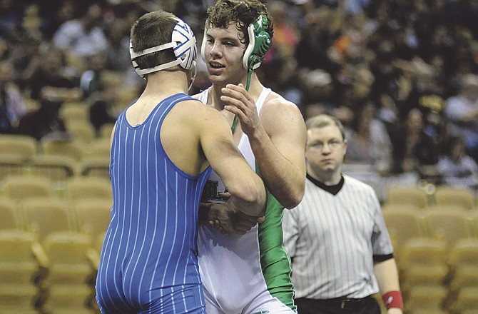 Blair Oaks' Caleb Roberts and Holden's Jacob Reiman shake hands after Reiman beat Roberts 6-0 in the 171-pound title match of the Class 1 State Championships on Saturday at Mizzou Arena. 