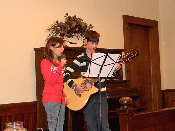 Cara Scheperle, left, and Andrew Couch, right, sing a duet during the Valentine's Party.