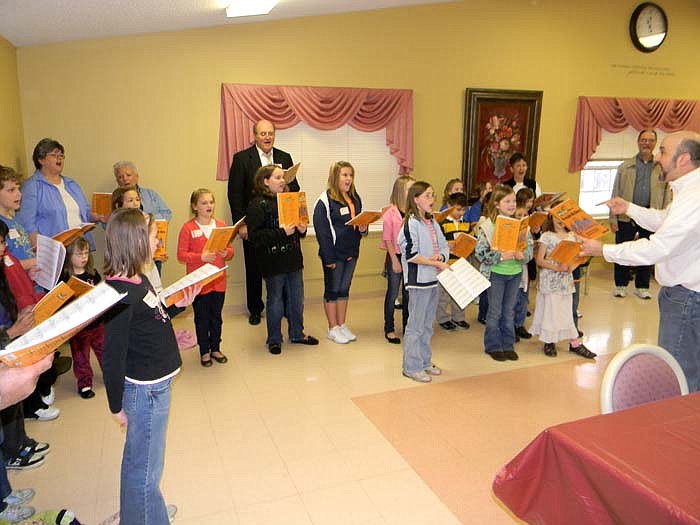 Members of the Share-A-Song Children's Choir Clinic perform at Moniteau Care Center Saturday, Feb. 19.