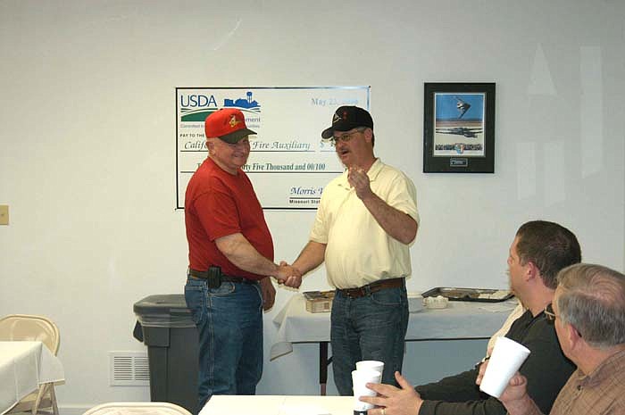 At the California Rural Fire Protection District annual dinner, Ed Bleich is commented for 35 years as a fire fighter by Fire Chief Steve Walters. Bleich served as chief for 22 years. 