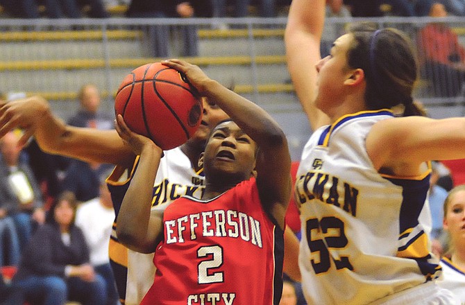 Monique Townson (2) of Jefferson City goes up for a shot during Wednesday night's semifinal game of the Class 5 District 9 Tournament against Hickman at Fleming Fieldhouse.
