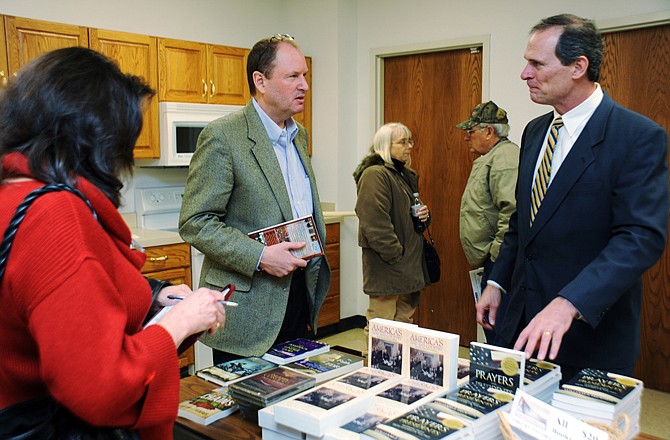 
Author William Federer, right, talks with Capital Tea Party members following his presentation Thursday on Islamic history and the Qur'an, in the Coca-Cola Community Room on Washington Street. 