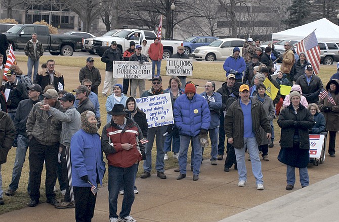 "Tea Party" supporters gather on the south side of the Missouri Capitol in Jefferson City on Saturday to rally together. Several hundred people attended to support the group, one of two factions gathering to rally on Saturday.