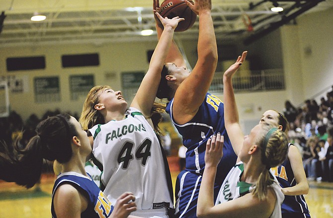 
Blair Oaks teammates Amy Dorge (44) and Maggie Dorge (right) battle Fatima's Lauren Allen for a rebound Friday night in Wardsville. Blair Oaks and Fatima are both in the Class 3 District 9 Tournament that starts today at St. James.

