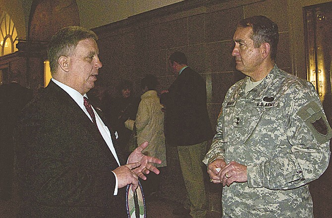 
Kurt Schwab, left, founder and national director of Veterans of Iraqi/Enduring Freedom, visits with Maj. Gen. Stephen Danner, adjutant general of the Missouri National Guard, before a proclamation signing at the Capitol. 