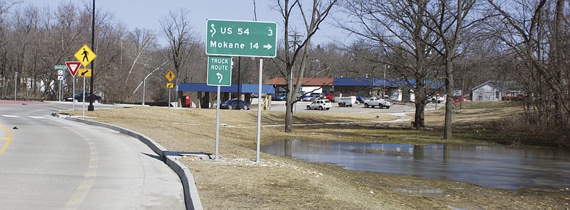 Don Norfleet/FULTON SUN photo: An unwanted pond, caused by improper drainage, has formed at the southeast corner of the new roundabout in Fulton.