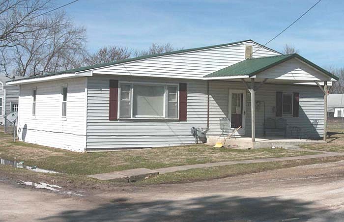 This house on Academy Street in Clarksburg was a center of activity Monday, Feb. 28, after the discover of two bodies.