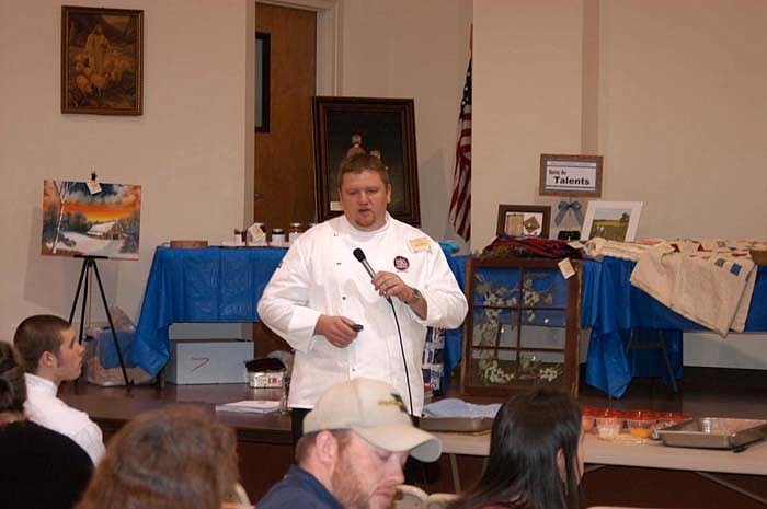 Isle of Capri Chef Jason Martin recounts the steps he took to becoming a chef before preparing a dish to serve to many of those present at the Women as Landowners meeting. 