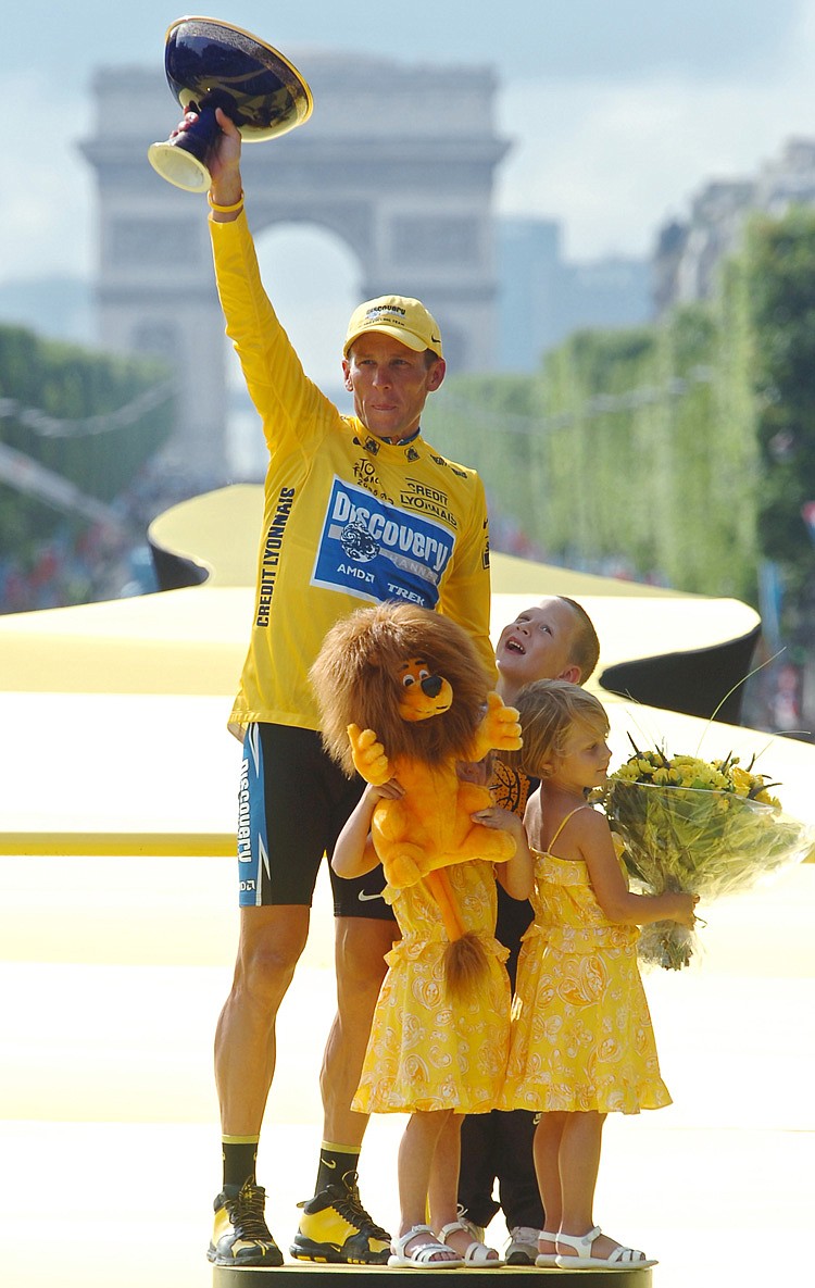 In this July 24, 2005, file photo, Lance Armstrong, of Austin, Texas, holds the winner's trophy as his son Luke, rear right, his twin daughters Grace, right, and Isabelle, look on, after winning his seventh straight Tour de France cycling race, during ceremonies on the Champs-Elysees avenue in Paris, after the 21st and final stage of the race between Corbeil-Essonnes, south of Paris, and the French capital. Almost a month after finishing 65th in his last competitive race in Australia, and nearly six years removed from the last of an unprecedented seven straight Tour de France titles, the 39-year-old cyclist made clear there is no reset button this time. He is retiring from cycling.