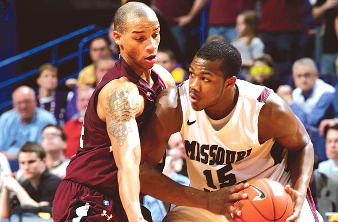 Jermaine Mallett of Missouri State looks for a passing lane as he is defended by John Freeman of Southern Illinois during the second half of Friday's game in St. Louis.