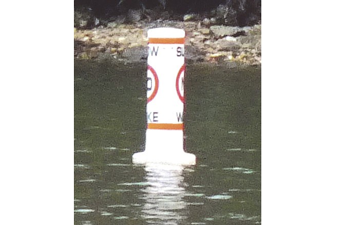 
This No Wake buoy is located at the mouth of the launch ramp cove at Pa He Tsi in Lake of the Ozark State Park. Under state law, boaters must slow to idle speed when they are within 100 feet of any legally posted No Wake buoy. 