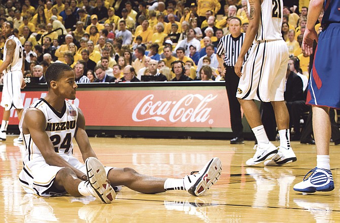 Kim English of Missouri sits out the court after being called for a foul during the second half of Saturday's game against Kansas at Mizzou Arena. 