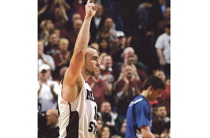 
Adam Leonard of Missouri State celebrates during the final seconds of the Bears' 60-50 win Saturday over Creighton in the semifinals of the Missouri Valley Conference Tournament in St. Louis.