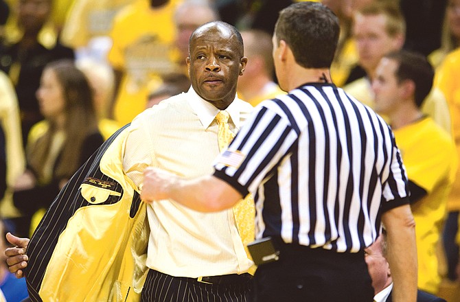 Missouri coach Mike Anderson takes his jacket off as he argues a call during the second half of Saturday's game against Kansas at Mizzou Arena. Anderson believes the Big 12 Tournament is a fresh start for Tigers.
