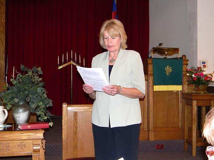 Judy Scott reads as the guide for the World Day of Prayer.