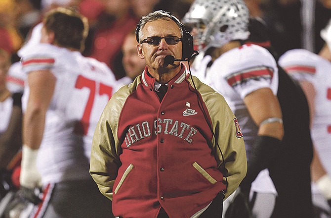 Ohio State suspended and fined head football coach Jim Tressel on Tuesday for violating NCAA rules. 